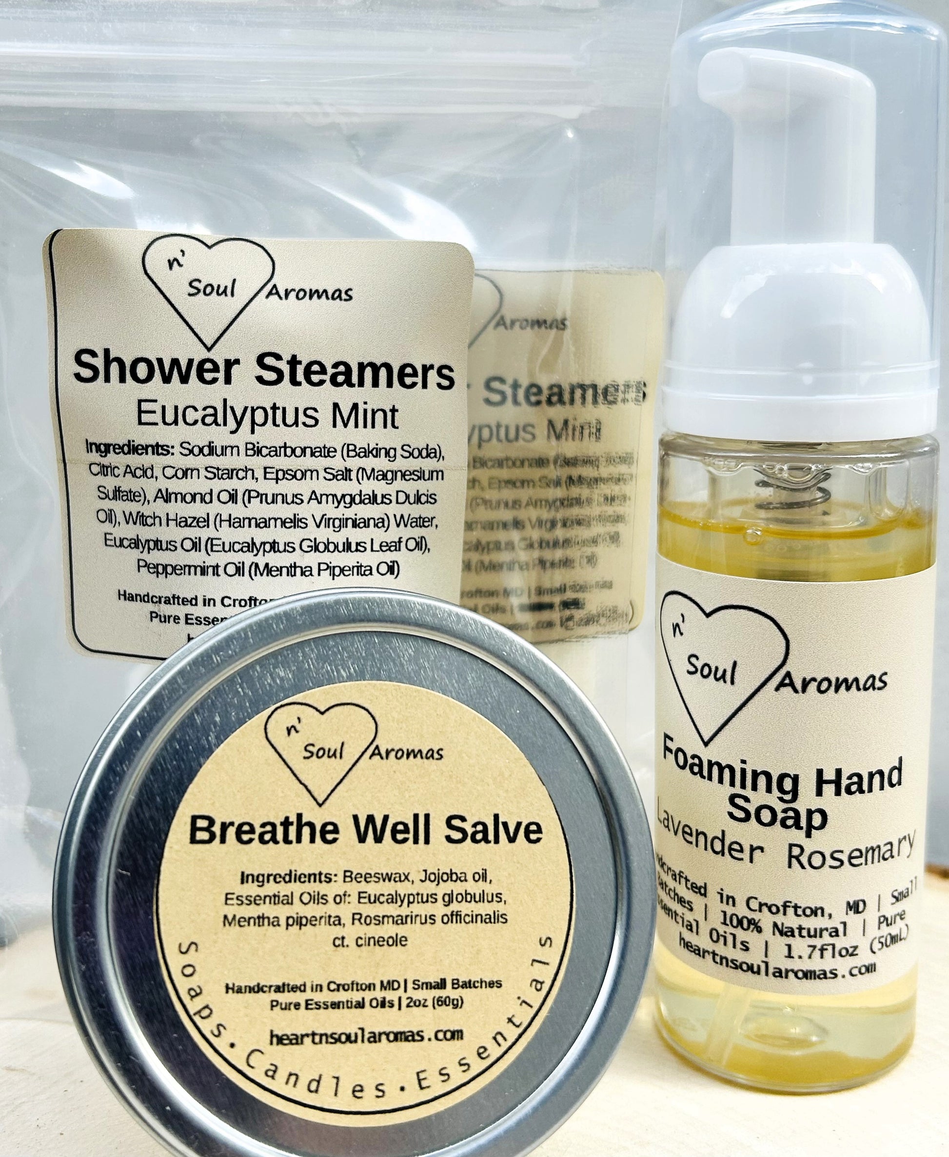 Collection of Soul Aromas products including shower steamers, breathe well salve, and foaming hand soap.